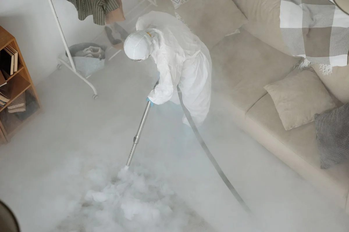 Biohazard cleanup technician in protective equipment, Summitview, WA